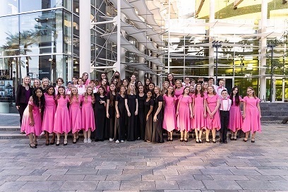 Full choir in pink & black formalwear outside the Mesa Arts Center