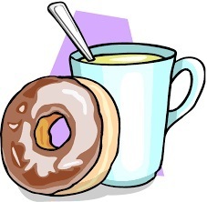 Coffee mug with donut resting up against it.